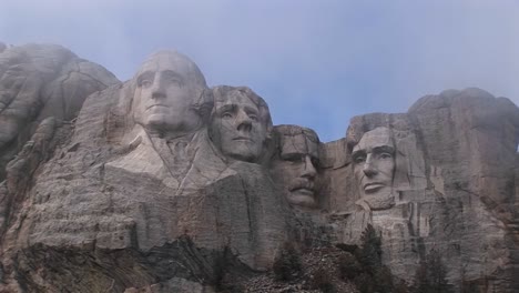 a look up at mt rushmore before all the mist has dissipated