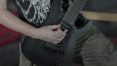 heavy metal guitarist playing intense on his guitar