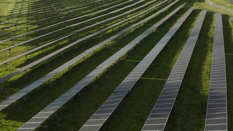 aerial of large array of solar panels for renewable energy from sun