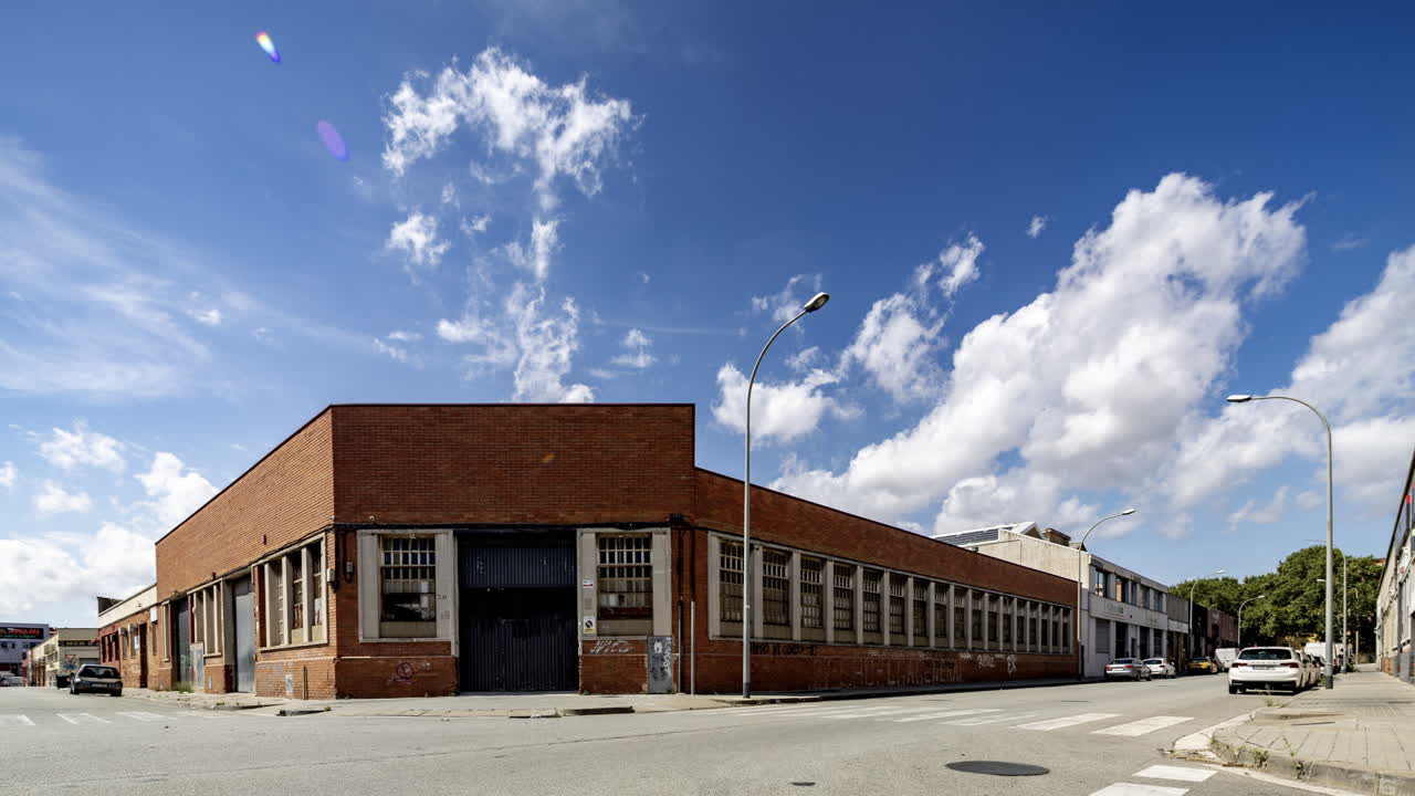 Old factory and industrial complex with passing clouds