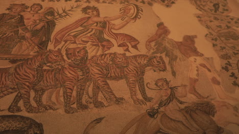 ancient mosaic artwork depicting tigers and mythological figures in intricate detail