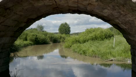 Slow-aerial-fly-through-of-an-old-stone-bridge-in-Finland-near-Kerava