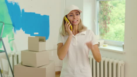 woman talking on phone during home renovation