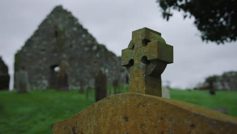 ruin of an old stone church with graves ireland