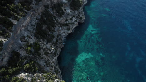 aerial drone video of tropical paradise sea cliffs in the mediterranean, sardinia, costa azzurra