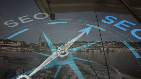 animation of compass overlaying coastal town with boat wake in background