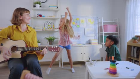 children learning and playing music in a classroom setting