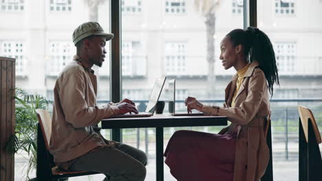 Cafe,-black-man-and-woman-with-a-laptop