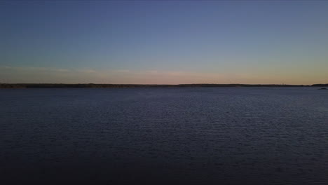 drone shot of beautiful ocean at dusk