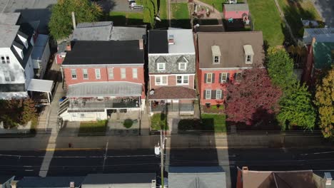 static aerial establishing shot of homes along street in small town in united states