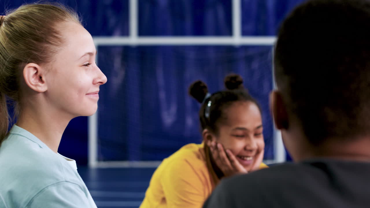 Children sitting on the floor and talking