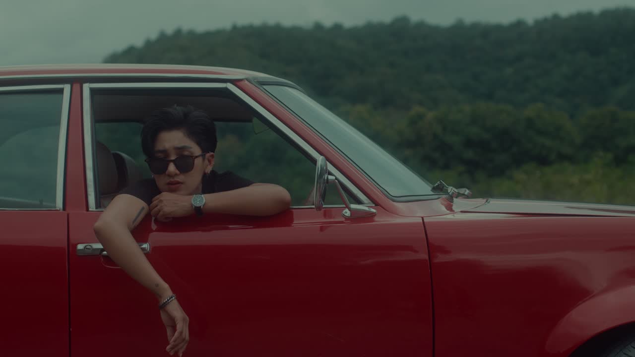 Person in Vintage Red Car