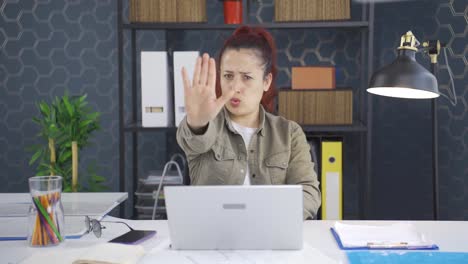 Business-woman-saying-stop-to-camera.