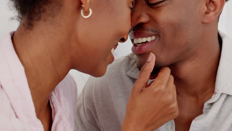 Love,-African-couple-and-kiss-with-smile-in-happy