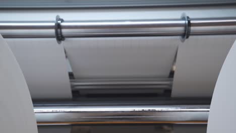 Huge-Rolls-Of-Paper-On-Rolling-Slitter-For-Custom-Cutting-In-A-Printing-Factory