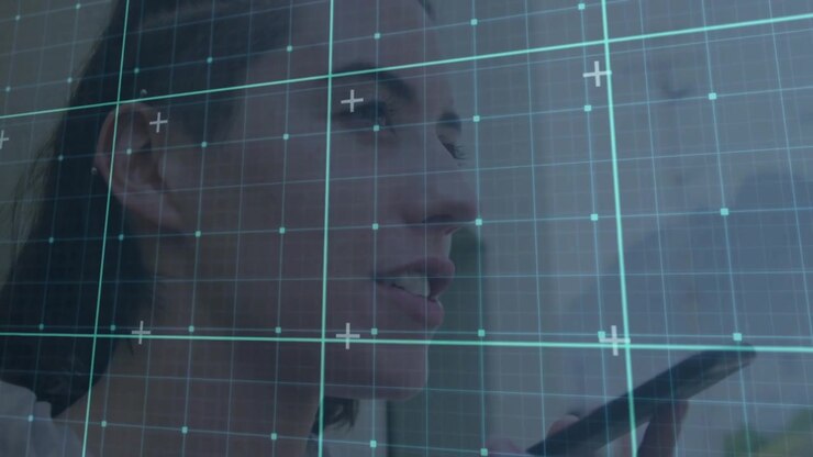 Woman lifting smartphone toward mouth in office capturing audio with AR tech grid scanning face