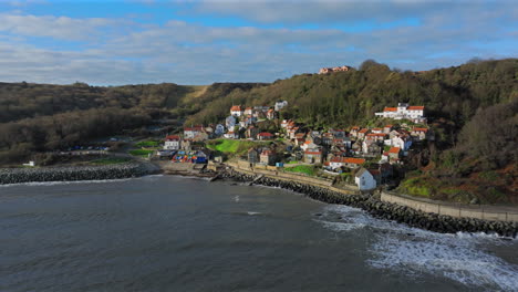 wide angle drone shot of runswick bay on sunny winter day yorkshire uk