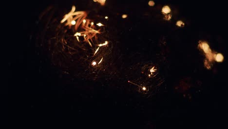 hypnotic steel wool burning sparkles in darkness round bokeh