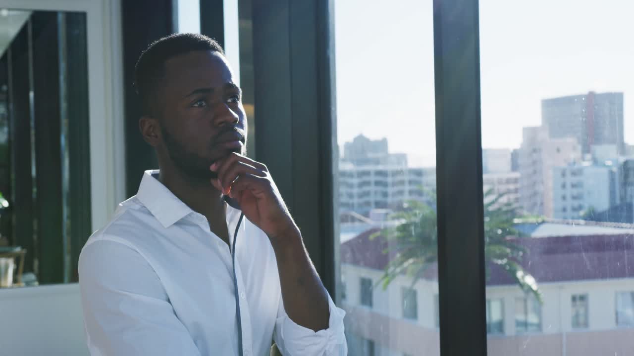 Young man looking through the window
