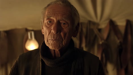 close-up portrait of a serious elderly man