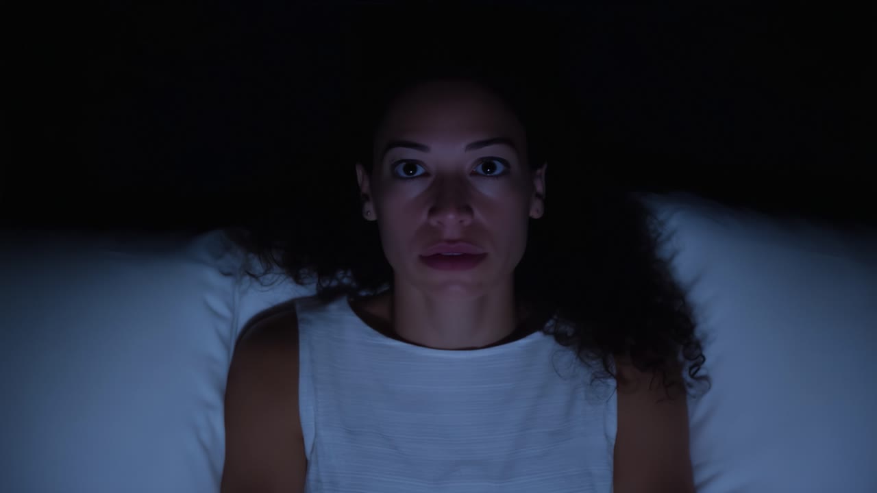 A Woman Awaits in Darkness: Exploring Emotions of Anticipation and Isolation in a Dimly Lit Room