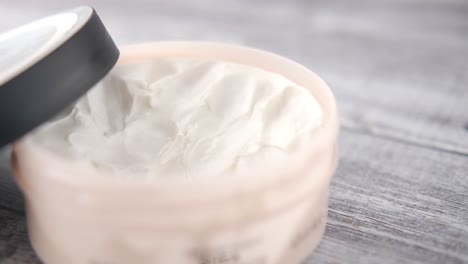 open jar of cream or body butter