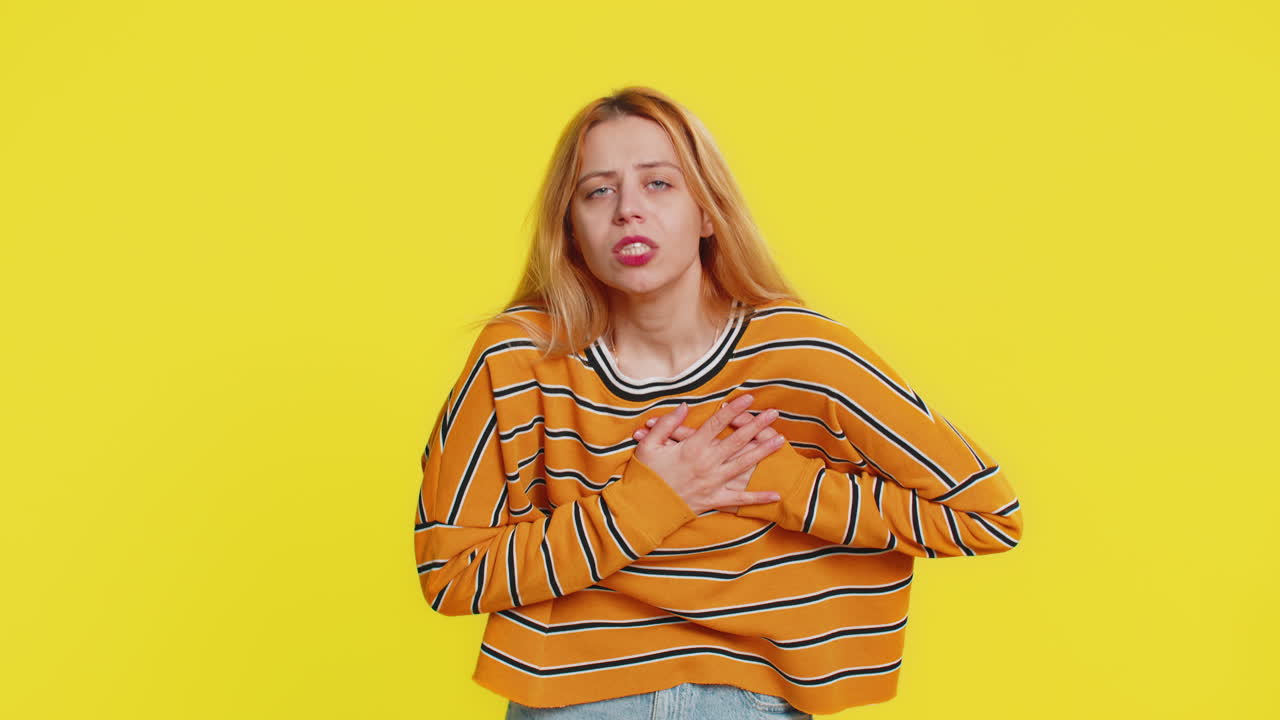 Stressed ill sick woman suffers from tension holding chest with heart pain attack risk of stroke