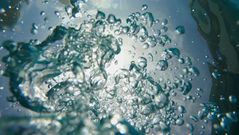 blow bubbles under water sinking to the bottom