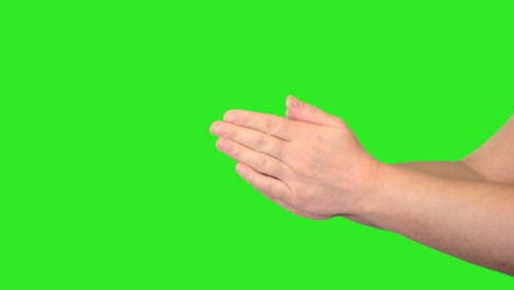 hand sign of female hand in front of green screen.