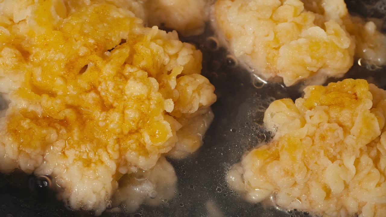 Crispy Fried Chicken Pieces in a Pan