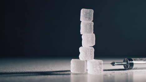 sugar cubes and syringe - a visual metaphor