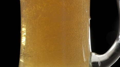 Fresh-blonde-beer-bobbles-in-pint-glass