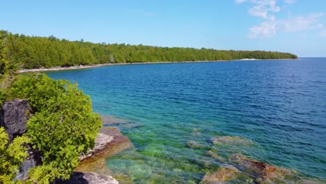 drone forward shot of beautiful rocky beach on georgian bay, ontario, canada