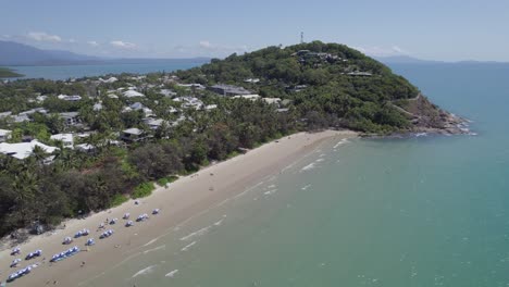 Beachgoers-And-Umbrellas-On-The-Sandy-Four-Mile-Beach-In-Summer-Near-Flagstaff-Hill-In-Queensland