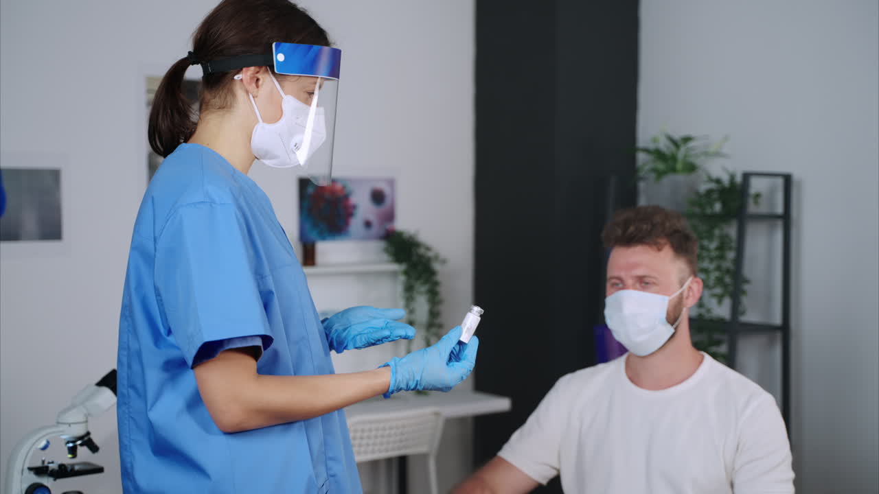 Doctor showing medicine to patient