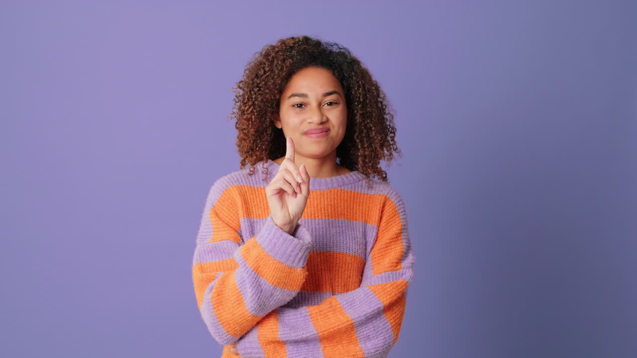 Young African American Woman Shaking Head No and Gesturing