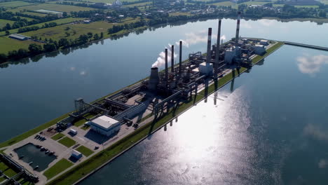 aerial view of a power plant on a lake
