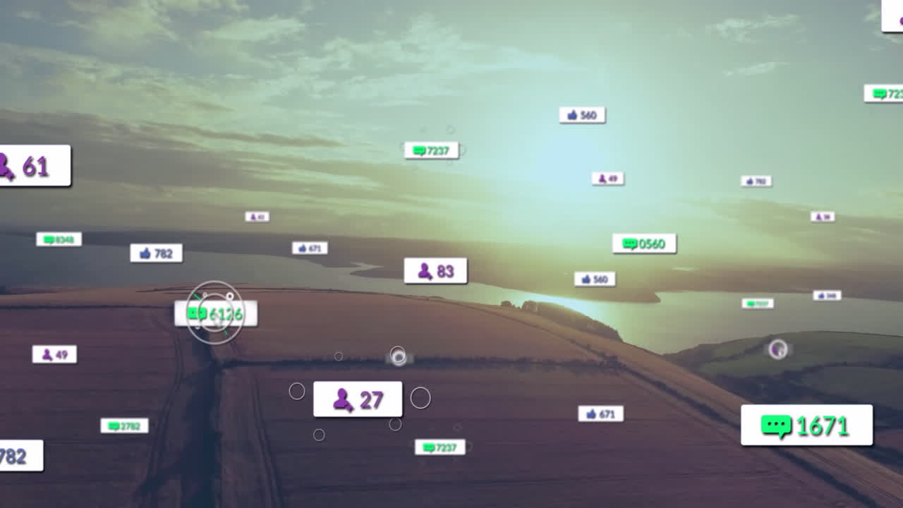 Social media interaction animation over aerial view of countryside landscape