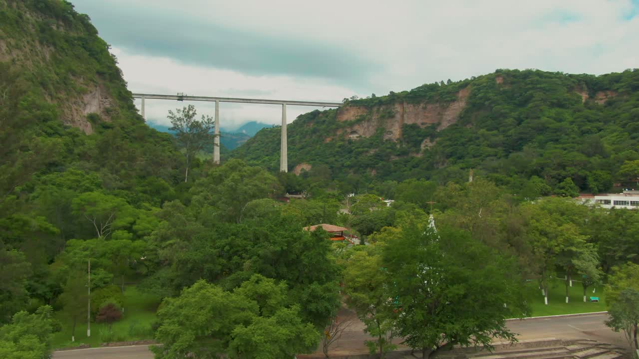 Drone film of Atenquique, Jalisco, a quiet town with a bridge in distance