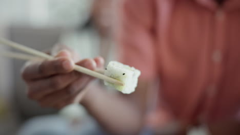 restaurant, hand and eating sushi for lunch