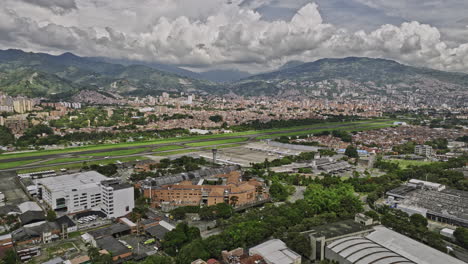 medellin colombia aerial v17 flyover campo amor and santa fe neighborhoods towards olaya herrera airport capturing san bernardo cityscape and mountainous views - shot with mavic 3 cine - november 2022