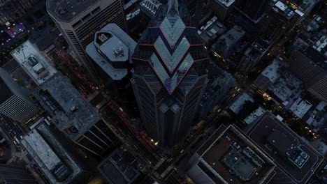 aerial footage of one liberty place, a skyscraper in center city philadelphia, captured after sunset