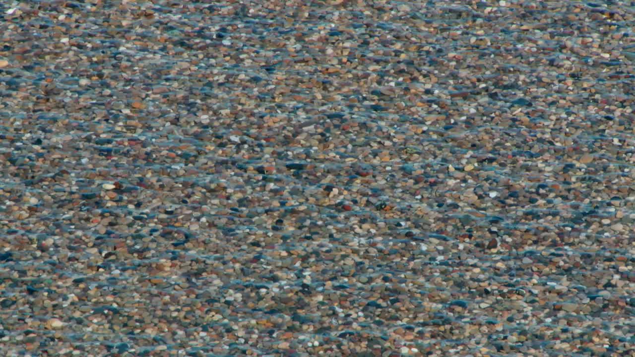 Sea Waves Over Pebbled Shores. Close-up Shot