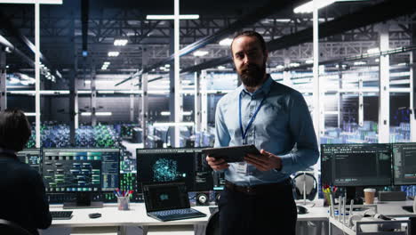 man briefing investors on server room machine learning hardware