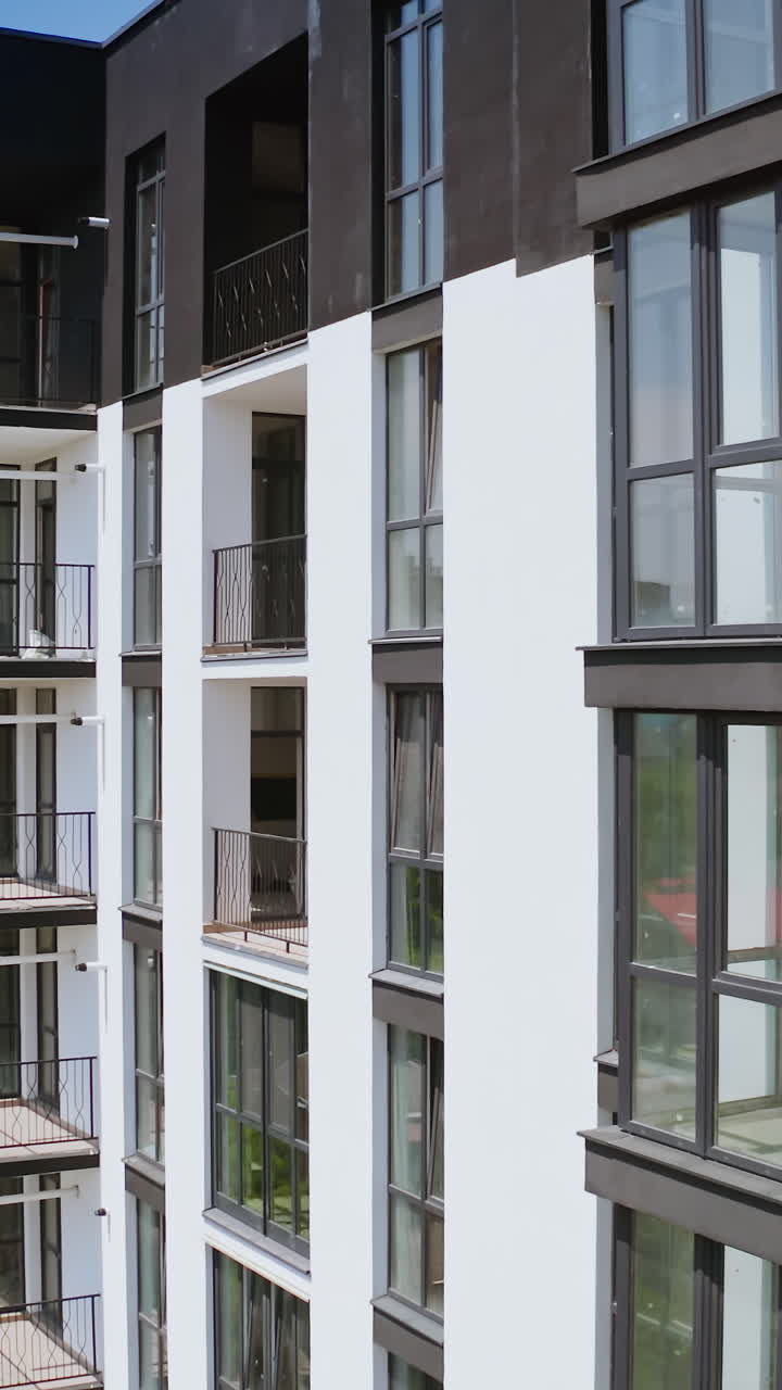 Urban landscape of apartment complex. Aerial view of typical multi level apartment building. Vertical video