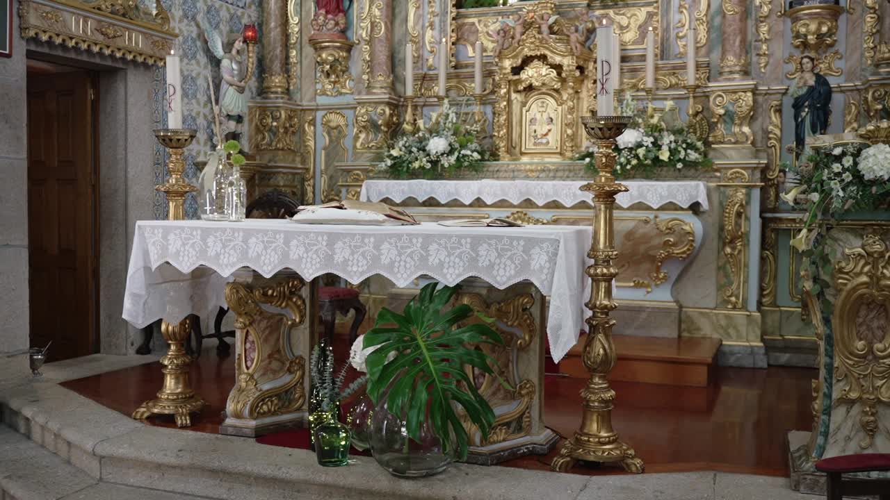 baroque church altar with gold elements floral decor and ceremonial objects