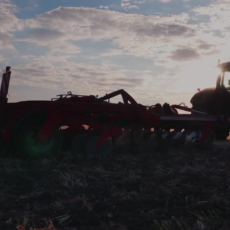 tractor with drill goes through the field 1