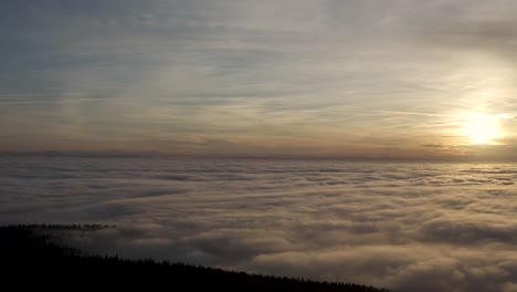 drone flight over the boehmerwald during a breathtaking cloudy sunset