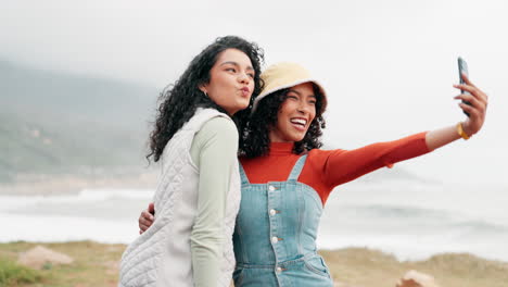 two friends taking a selfie at the beach
