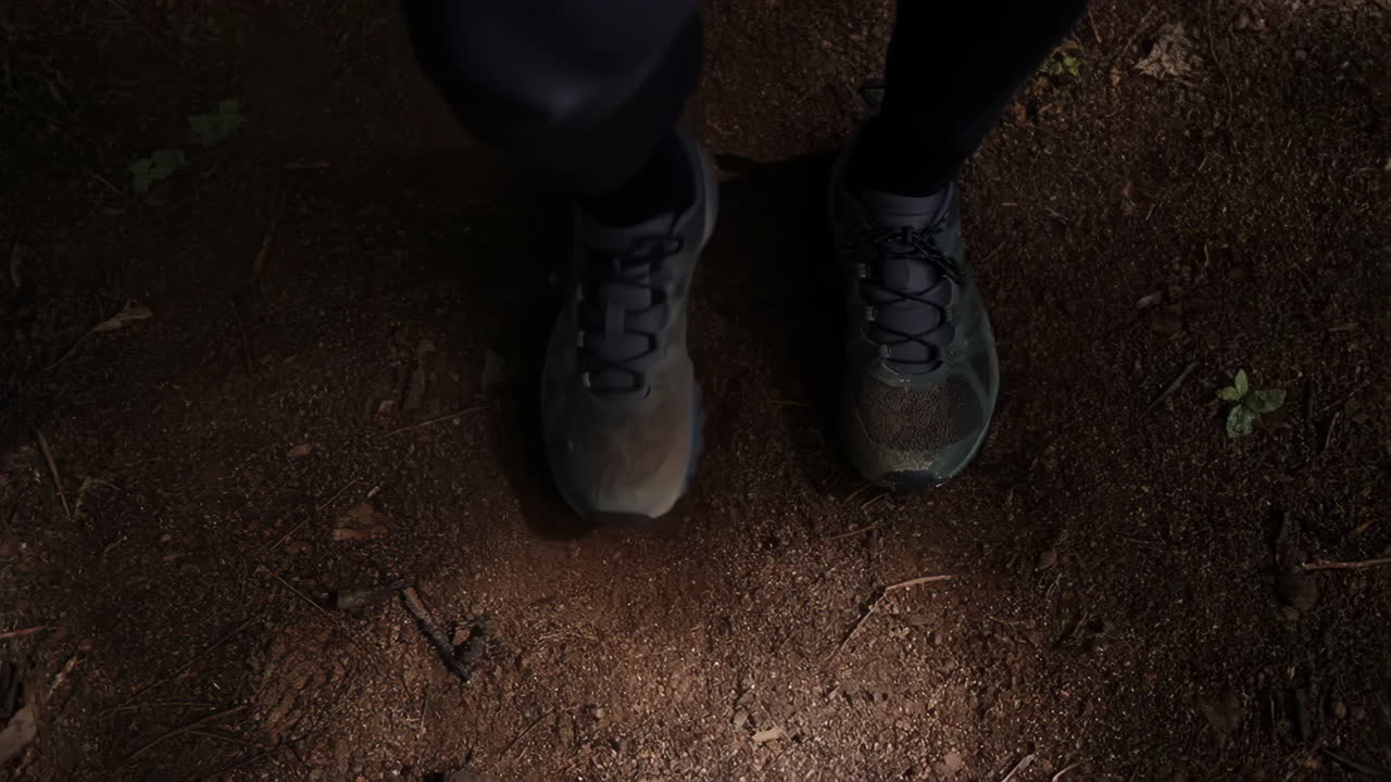 Person's Feet in Trail Shoes on a Dirt Path